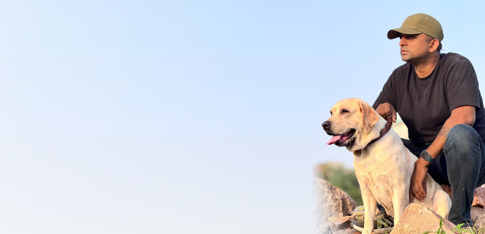 Paltoos Guardian QR Tag, pet parent with his Labrador wearing a Paltoos collar and Guardian tag